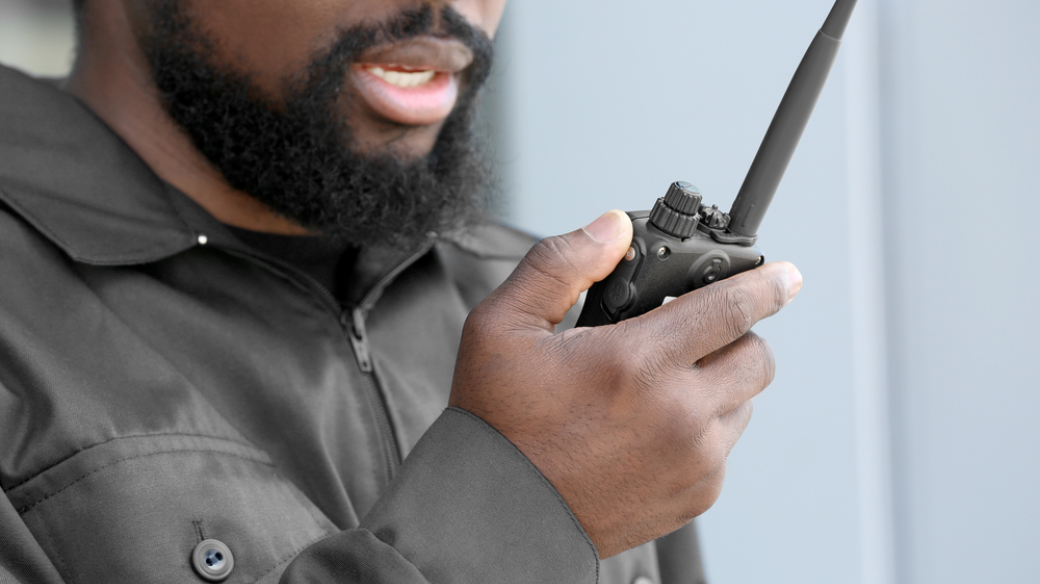 Man holding a walkie talkie